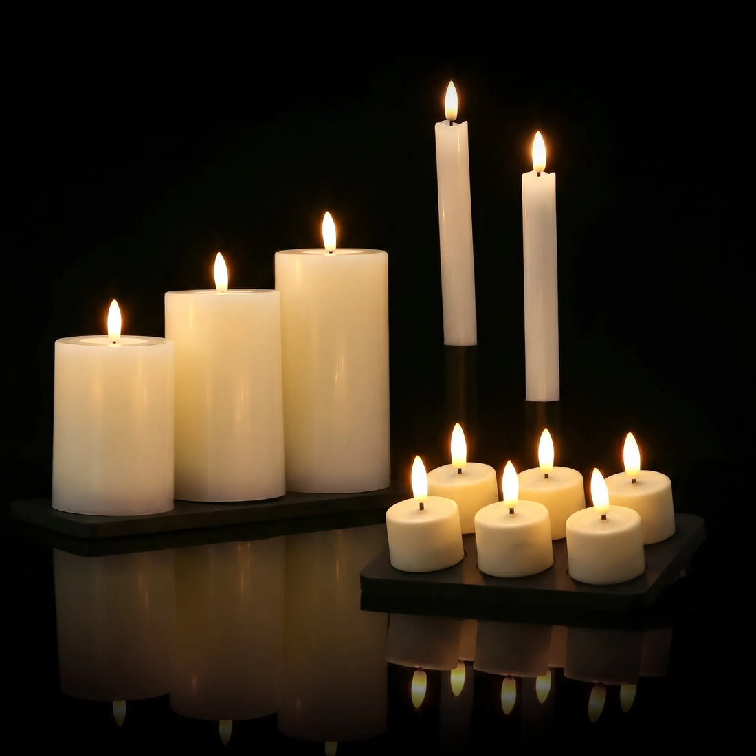 KENN® GlowPro oplaadbare kaarsen collectie in een studio setting op zwart glazen ondergrond.